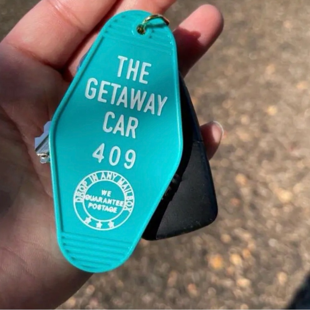 Taylor Swift Themed Blue Motel Keychain That Says "The Getaway Car" NEW